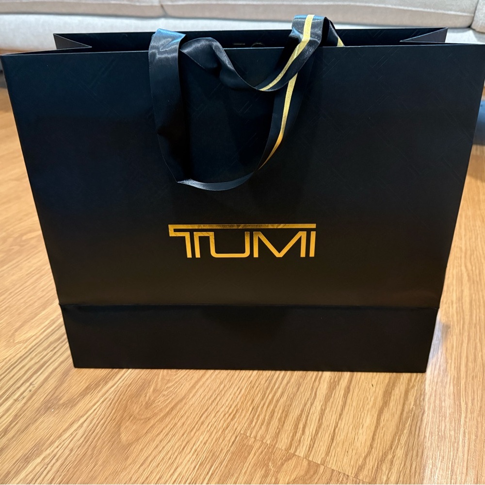 TUMI Black and Gold medium carry Bag